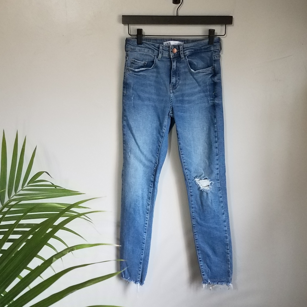 Zara Light wash distressed mid rise skinny jeans